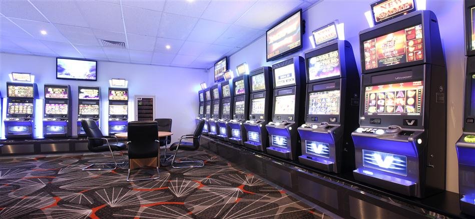 Gaming machine bank with illuminated displays in the Axalis showroom
