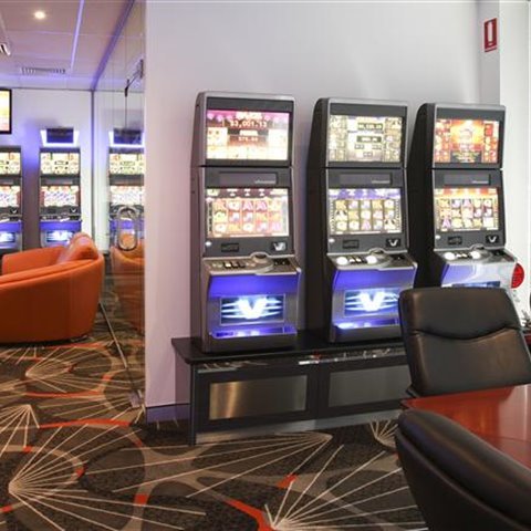 Row of poker machines ready for a pub gaming room